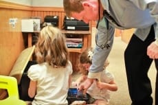 Image: Dr. Lail with children - Pediatric Dentistry at Lail Family Dentistry in Duluth, Georgia