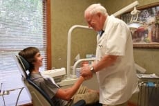 Image: Dr. Lail greets child patient - Pediatric Dentistry at Lail Family Dentistry in Duluth, Georgia